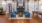 a room with blue chairs and a fireplace