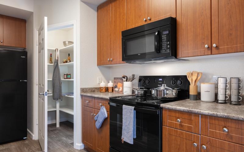 a kitchen with wooden cabinets