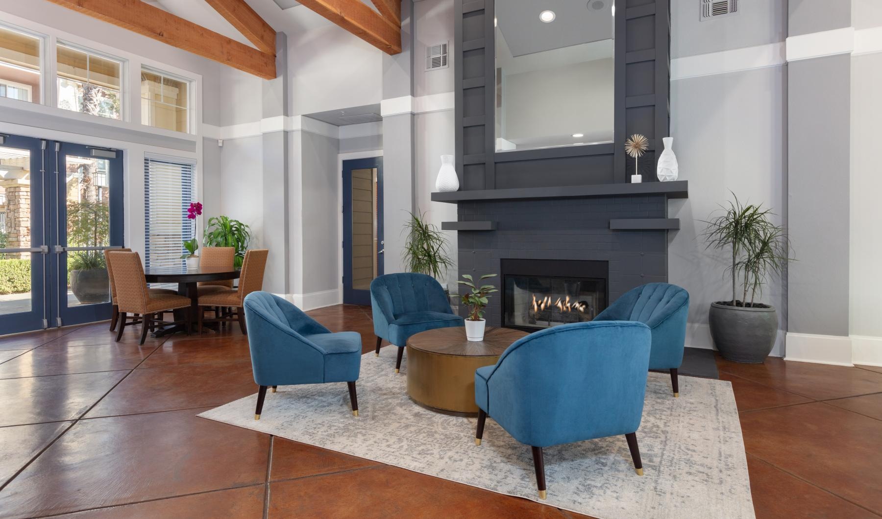 a living room with blue chairs