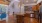 a kitchen with wooden cabinets