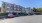 a car in a parking lot in front of a building