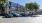 cars in a parking lot in front of a building