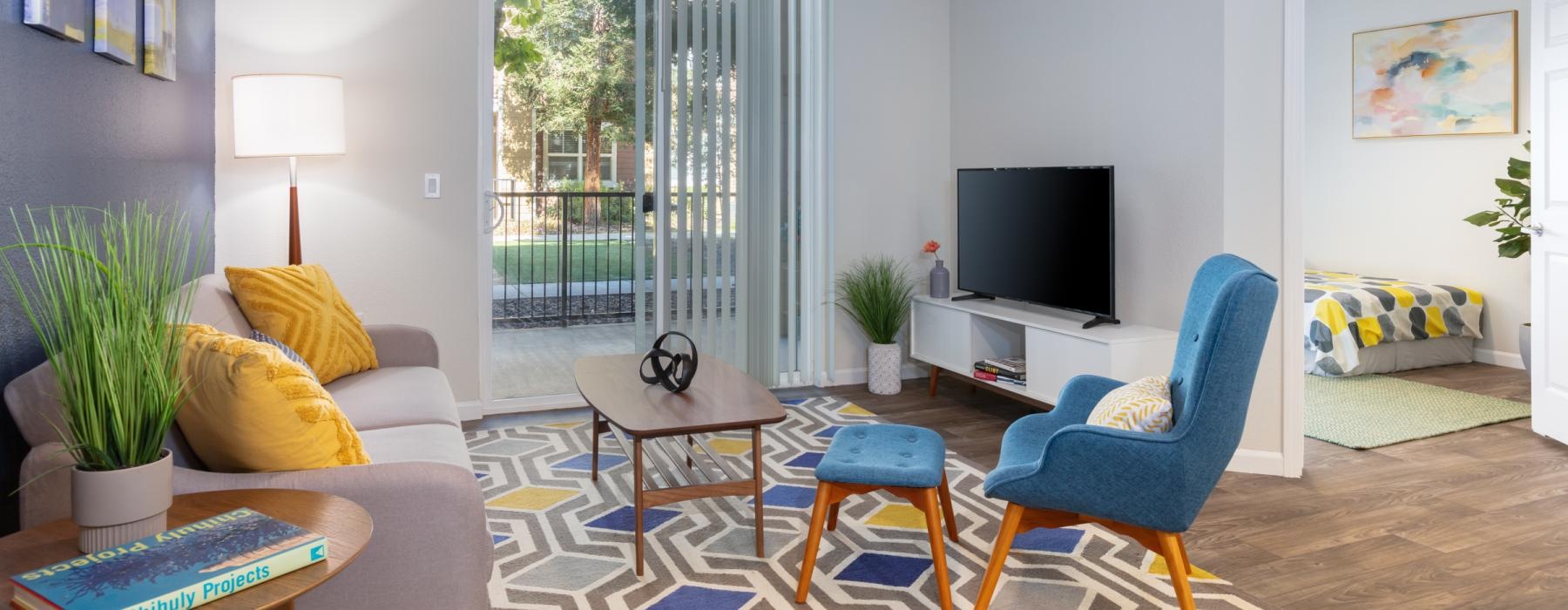 a living room with a tv and furniture